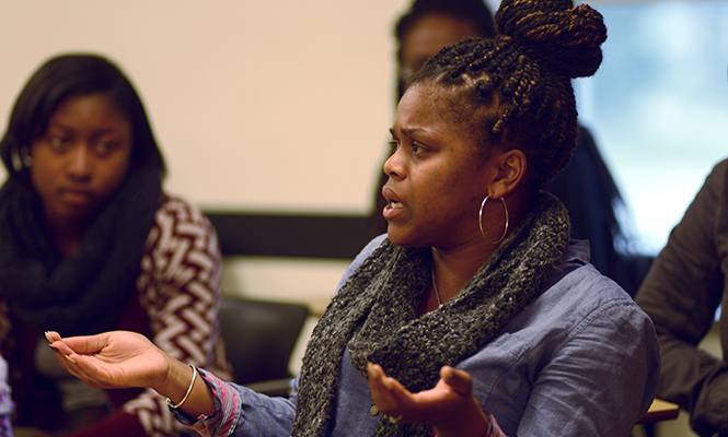 Savanna Mccarthy, a freshman student in Traci Williams 'Black Images' class at Kent State University participates in a discussion on how the gun shot on campus last night was handled on April 3, 2014.