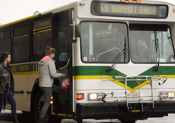 Students catch the bus at the Student Center, April 28, 2014, headed toward Summit East/Stadium, two large lots where many commuters have to park for the first few years at Kent State.