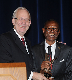 Lefton giving the Diversity Trailblazer Award to Gene Shelton, Nov. 14, 2014. Image courtesy of Kent State.