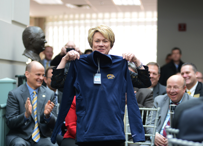 Kent State president-elect Bevely Warren holds up a Kent State pullover she received from the board of trustees, after she was announced as the university's 12th president, Jan. 8, 2014.