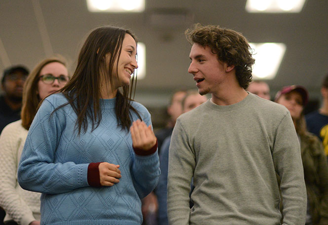 (From left) Sophomore communication studies major Champaign Bounds and sophomore applied engineering major Josh Bodziony share a moment together Wednesday, April 16, 2014 at the weekly Campus Navigators Christian group in Bowman Hall.