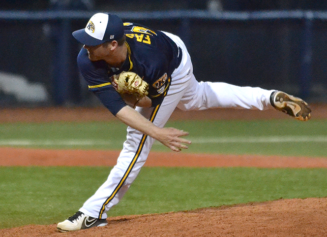 Kent State redshirt junior John Fasola follows through after a pitch towards the end of the game against University of Pittsburgh, April 16, 2014. The Flahes won, 4-1.