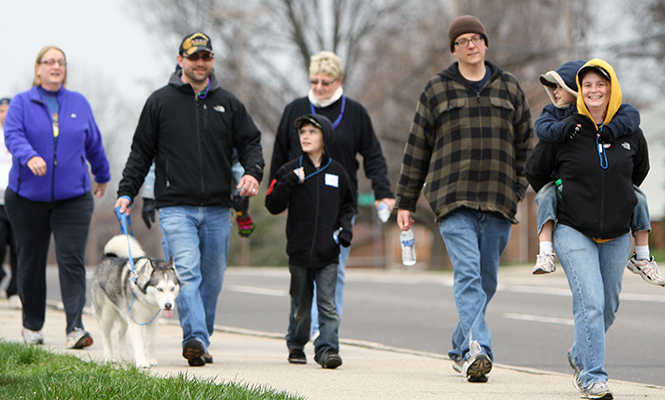 Families and friends gathered for awareness and in remembrance of loved ones for the Out of the Darkness suicide prevention walk Saturday, April 13, 2013.