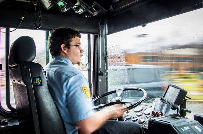 Student Stephan Ringler drives the PARTA bus through front campus, April 3, 2014.