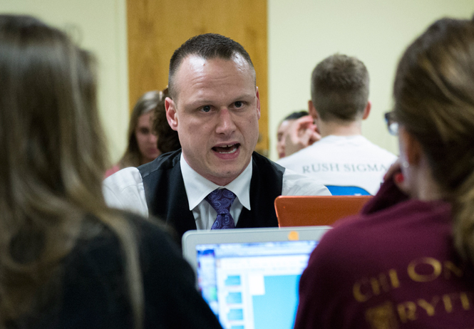 Kent State associate counsel Michael Pfahl speaks to a group of students in the provost leadership academy, Monday, March 31, 2014. The group brought Pfahl in to discuss their project that would bring a fitness trail to Kent State, featuring different exercise stations to promote a unique way to get healthy.