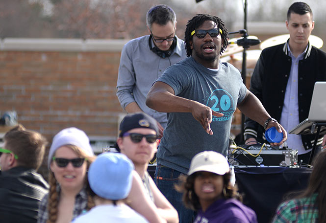 USG's new executive director Marvin Logan tosses frisbees to the crowd before the opening acts of Flashfest Thursday, April 24, 2014. USG is responsible for all of the planning and execution of Flashfest.