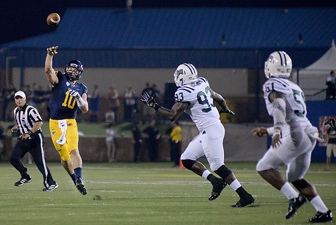 Quaterback Colin Reardon throws a pass at the season opener game against the Ohio University Bobcats Saturday, Aug. 30, 2014 in Dix Stadium. The Flashes lost 17-14 with an opposing field goal scored in the last three seconds of the game.