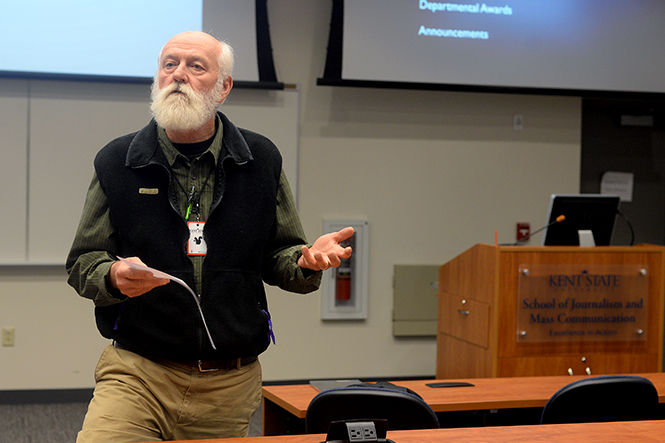 David LaBelle, Director of Photography for the School of Journalism and Mass Communication, presents students with awards for their success in the field of photojournalism at the Freshman Welcome and Student Art Exhibit Wednesday, Sept. 24, 2014.