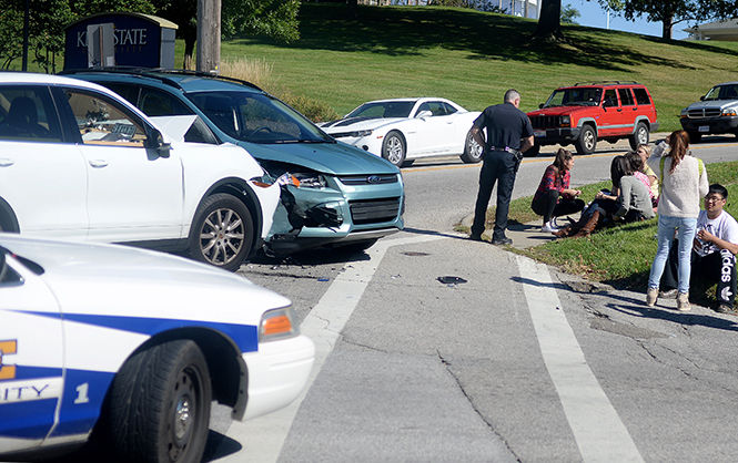 The Kent Stater Kent City and Kent State Police respond to a car accident on S. Lincoln St. and Summit St. around 3p.m. Tuesday, Sept. 23, 2014.