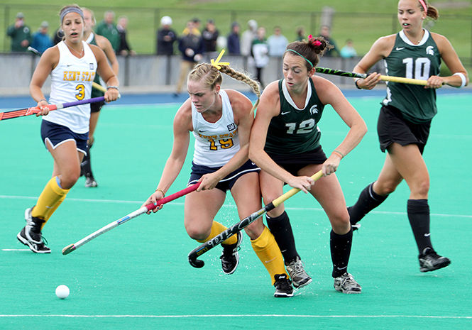 Kent State sophomore Madison Thompson tries to steal the ball from Michigan State's Alli Helwig during a match Saturday, Sept. 13, 2014. Kent State lost, 3-4, in overtime.