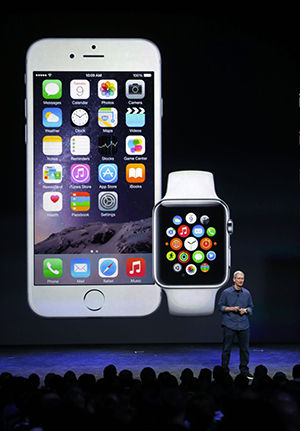 Apple CEO Tim Cook introduces the iPhone 6 and the Apple smartwatch at the Flint Center on Tuesday, Sept. 9, 2014, in Cupertino, Calif. (Karl Mondon/Bay Area News Group/MCT)