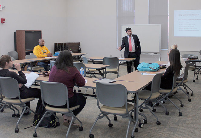 Ediz L. Kaykayoglu, Assisstant Director of the Education Abroad Office of Global Education, meets with students who have studied abroad to teach them how to use their experience to further their careers.