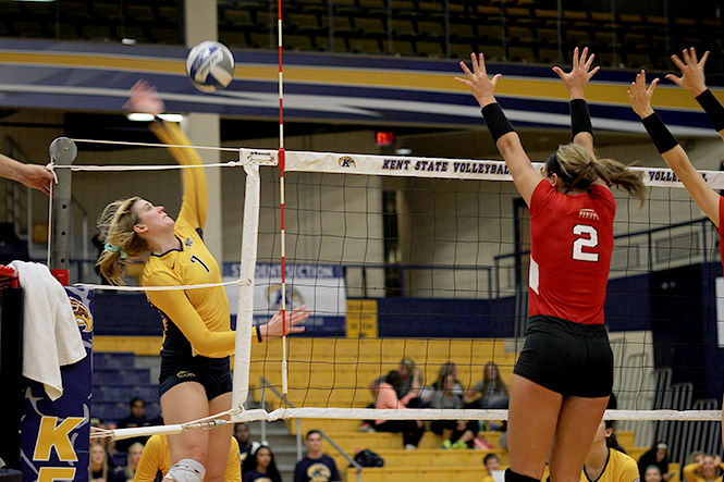 Kelly Hutchison spikes the ball against Youngstown State University to score a point for Kent State Sept. 16, 2014. The Flash won, 3-2.