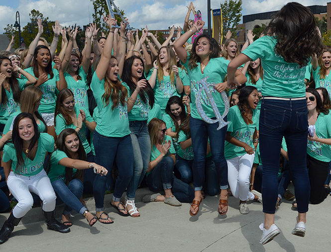 The Kent Stater members of Alpha Xi get the crowd pumped up Sunday, Sept. 21, 2014, at Kent State's sorority recruitment.