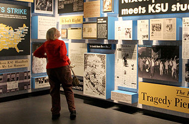 Kent State alumni Susan Avery of Denver, CO, tours the May 4 Visitor's Center Wednesday, Sept. 17, 2014. Avery graduated in '82 and said that she wanted to visit the center to pay her respects.