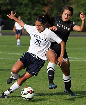 Kent State's Brittany Maisano blocks the opponent from stealing the ball during a game against Oakland Friday, Sept. 19, 2014. The teams tied the game 1-1 in double overtime.