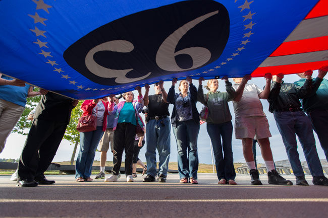 Visitors to the Flight 93 Memorial participate in the annual presentation of the Flight 93 Flag in memory of those who lost their lives in the plane crash on September 11, 2001. This year marks the 13th anniversary of the attacks.