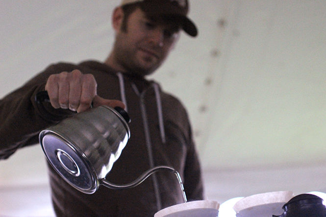 Mike Mistur from Bent Tree Coffee Roasters makes coffee at the second annual Nuts About Coffee event outside the Williamson Alumni Center on Thursday, October 16, 2014. Participants tasted coffee samples from coffee shops in Kent, and the shop with the best score received the "Best Coffee in Kent" award.