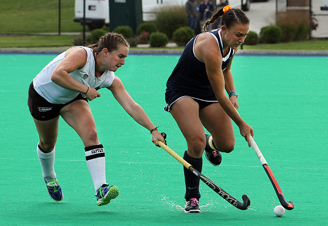 Kent State's Hannah Faulkner rushes the ball down the field during a match against Ohio University Saturday, Oct. 11, 2014. The Flashes won, 4-3.