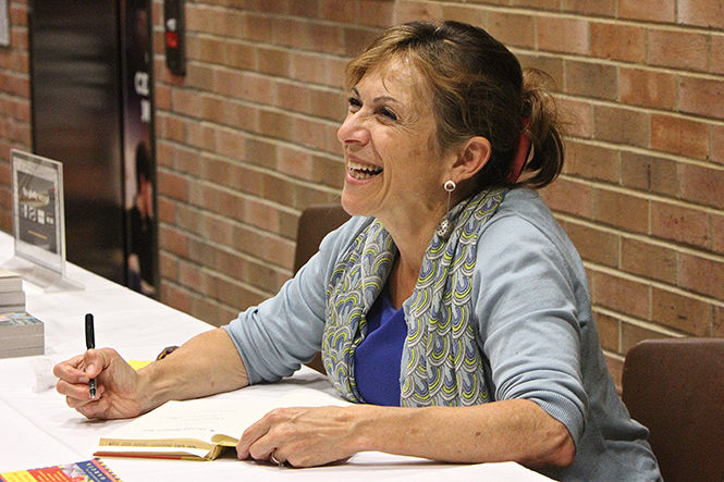 Cuban-American author Cristina Garcia holds a book signing following her lecture about the importance of reading fiction Thursday, Oct. 9, 2014 in the Kiva.