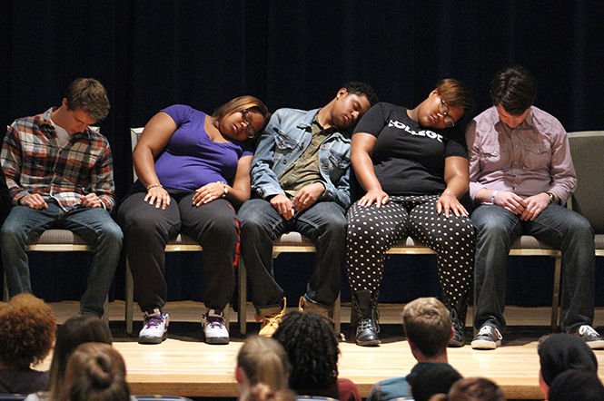 A group of student volunteers are hypnotized into a deep sleep during Chuck King's Culture Shock program in the Kiva Wednesday, Oct. 1, 2014. King hypnotized the students to act differently than their race or ethnicity and put them in different scenarios.