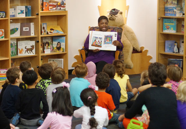 Award-winning author Angela Johnson reads to the Kent State Child Development Center’s kindergarten class in the Reinberger Children's Library on Thursday, Oct. 2, 2014.