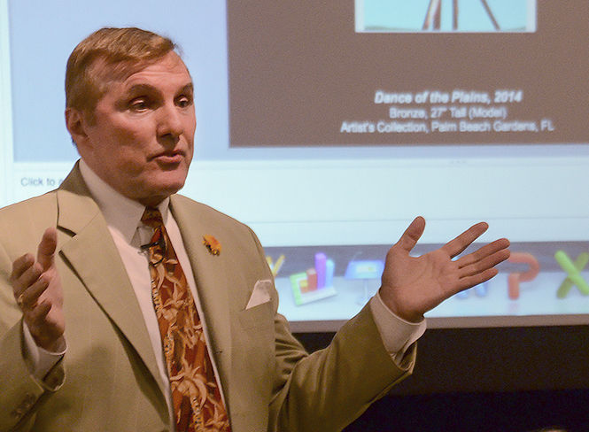 Visual artist John Raimondi discusses his work as part of the College of the Arts Thomas Schroth Visiting Artist Series in Kent State's art gallery Thursday, Oct. 9, 2014.