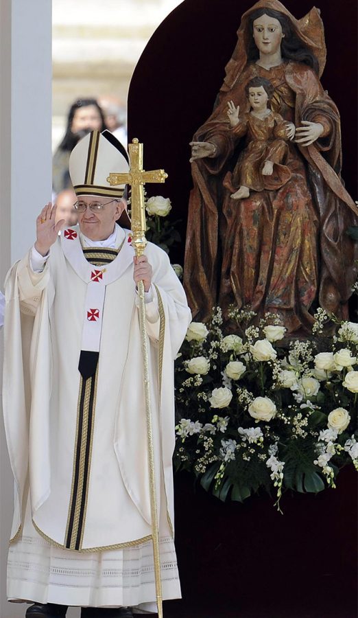 Pope Francis waves during his grandiose inauguration mass at St. Peter's square on March 19, 2013 at the Vatican. World leaders flew in for the inauguration mass for Pope Francis in St. Peter's Square on Tuesday where Latin Americas first pontiff received the formal symbols of papal power.