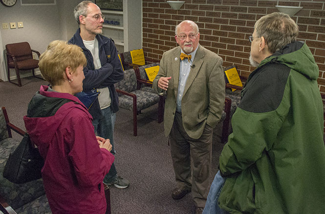 Professor Jerry Lewis, author of the book "Sports Fan Violence in North America," speaks with alumni following his lecture on sports fan violence and its sociological impact Thursday, Nov. 6, 2014 in the Williamson Alumni Center.