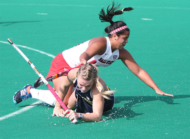 Sophomore forward Madison Thompson and Ball State's Mikayla Mooney fight for the ball during Kent State's 6-1 victory Saturday, Oct. 25, 2014 at Murphy-Mellis Field. The Flashes improved their record to 8-10 with the win and are undefeated in the Mid-American Conference.