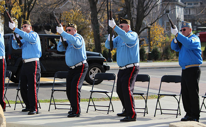 Veterans in uniform shoot their guns during a Veteran's Day ceremony hosted by PARTA and the Kent State University Hotel and Conference Center on Veteran's Day, Tuesday, Nov. 11, 2014.