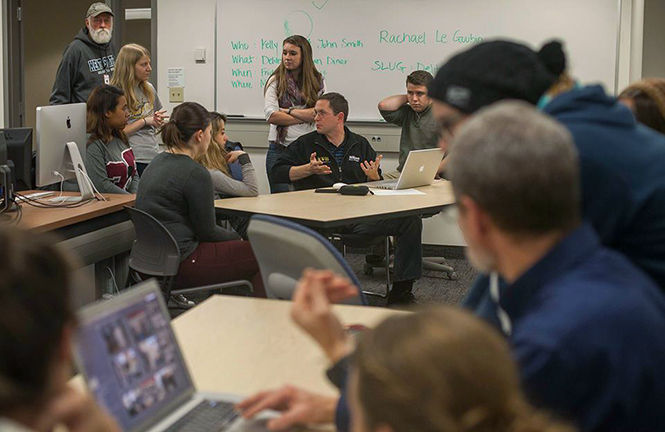 Bruce Zake and Scott Galvin help photojournalism students learn how to develop a workflow at the FocalPoint meeting Thursday, Nov. 6, 2014.