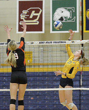 Kent State University's freshman outside hitter Kelsey Bittinger spikes the ball at Bowling Green University during their final game of regular season in the M.A.C. Center on Saturday, Nov. 15, 2014. The Flashes sent of their senior class with a 3-1 win over The Falcons and go into next weekends MAC Tournament as the No. 7 seed with a 16-13 overall record.