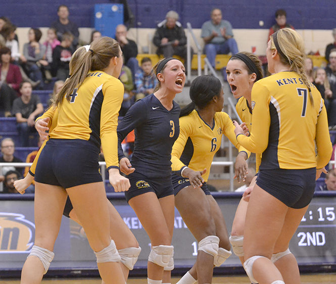 Kent State's volleyball team cheers each other on during the game against MAC opponent Ohio University on Thursday, Oct. 30, 2014. The Flashes lost the game, 3-1.