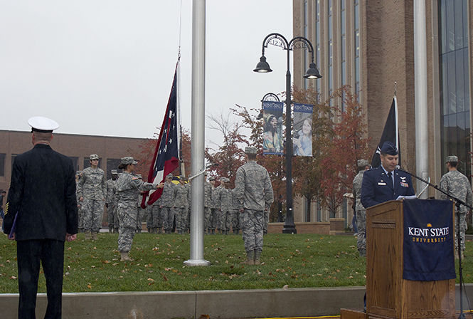 Lieutenant Colonel Daniel Finkelstein begins the annual Veteran's Day observance Thursday, Nov. 6, 2014 as the Kent State ROTC raises the Ohio flag.