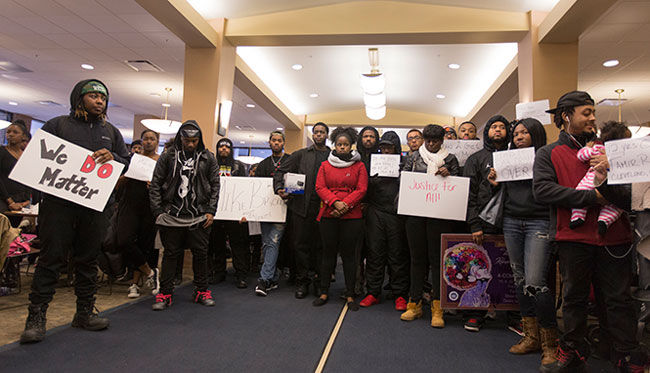 BUS holds a peaceful protest in the Student Center on Tuesday, Nov. 25, 2014, in response to the grand jury decision not to indict Officer Darren Wilson for shooting and killing Michael Brown.