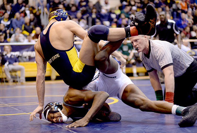 Kent State's Michael DePalma wins his final match at the 2014 MAC Championship wrestling meet Sunday, March 8, 2014, in the M.A.C. Center. DePalma's final defeat against an Ohio University player won him third place in his weight class.