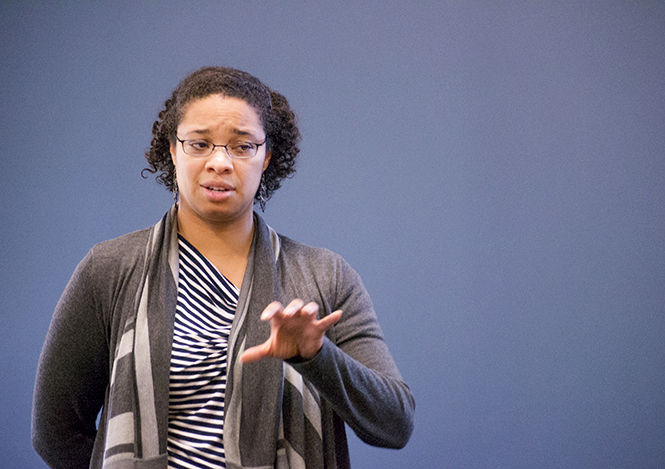 Desnee Stevens, assistant director of international student and scholar services, speaks to international students about Optional Practical Training workshops after graduation in Heer Hall on Thursday, Nov. 6, 2014.