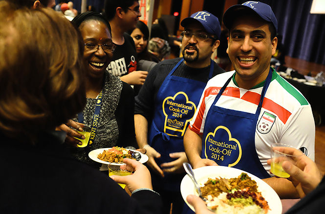 Team Iran chef Mohammad Moasher Ziad and Team Iran member Mohsen Mohseni Moghadam interact with the judges during the fifth annual International Cook-Off hosted in the Kent State Ballroom on Thursday, Nov. 20, 2014.