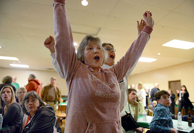 Democratic candidate Vicki A. Kline and her daughter, Lisa Kline, react to her lead in the race for Portage County Commisioner at The Italian American Society watch party in Ravenna on Tuesday, November 4, 2014.