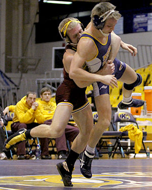 The Kent Stater Central Michigan's Joe Roth throws Kent State's Mack McGuire to the mat during their match in the M.A.C. Center on Sunday, Jan. 26, 2014.