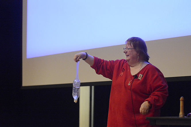 Kat Holtz, HIV specialist for the Portage County Health Department, demonstrates how large a small-sized condom is during her presentation about AIDS prevention and the United Nations vision of "Getting to Zero" with HIV on Dec. 1, 2014. Holtz said that if a guy ever claims his penis is too big for a condom, he should see this demonstration.