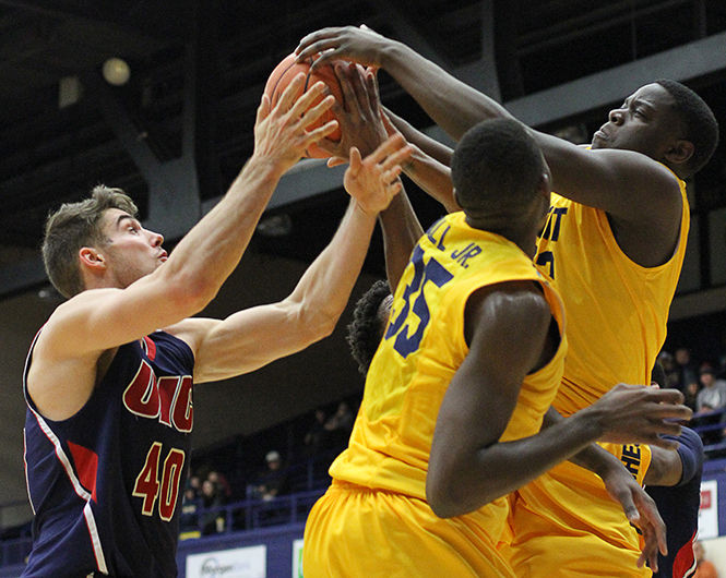 Freshman forward Raasean Davis tries to grab the rebound from University of Illinois at Chicago's Jake Wiegand during a game Saturday, Nov. 22, 2014. The Flashes won, 78-60.