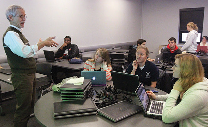 Professor Dale Richards presents audio projects produced by his class during his College Writing I class, Dec. 3, 2014.