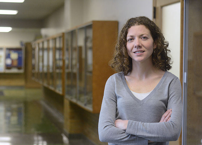 Kent State geology professor Elizabeth Herndon in McGilvery Hall on Monday, Jan. 12, 2015. Herndon ran in the first ever Beer Mile World Championship in Austin, Texas on December 3, 2014, where she ran 1 mile and drank a beer per quarter mile in a record time of 6 minutes and 17 seconds.