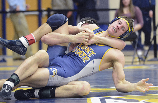 Kent State junior Tyler Buckwalter won by decision over Eastern Michigan's Devan Marry, 9-5, at the Beauty and the Beast wrestling and gymnastics event in the M.A.C. Center on Friday, Jan. 30, 2015. The Flashes swept their competition at the Beauty and the Beast for the third straight year as Kent State's gymnastics team defeated Pittsburgh 195.750 to 191.175 and the wrestling team beat Eastern Michigan 25-9.