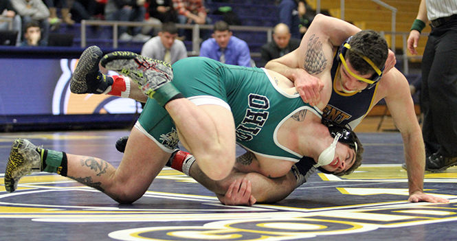 Kent State's Mike Vollant tries to keep Ohio's Cody Walters close to the mat during their wrestling meet in the M.A.C. Center on Friday, Jan. 16, 2015.