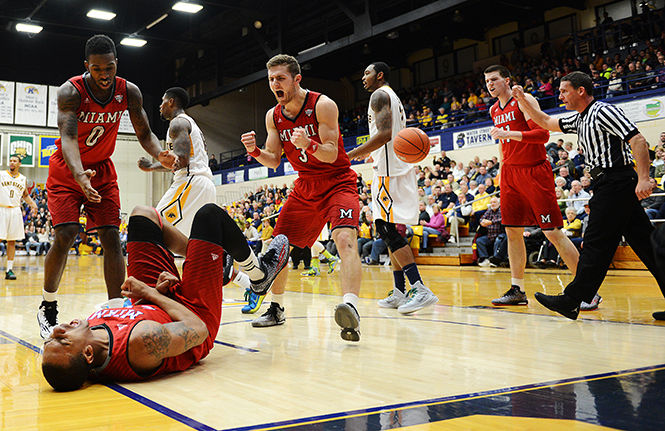 The Miami Redhawks react after hearing the outcome of the referee's call during the first half of gameplay against Kent State, February 7, 2015. Kent State would edge the Redhawks for a 61-60 win.