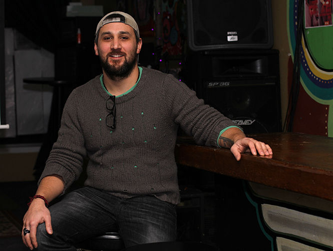 Jorge Delarosa, an independent filmmaker with The Slow Mutants, sits in the Stone Tavern in Kent before showing the film "Shivers" on Wednesday, Feb. 11, 2015.