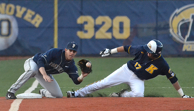 Sophomore infielder Justin Wagler (right) slides into third base at Wednesday's baseball game against University of Pittsburgh, April 16, 2014. Kent State won the game, 4-1.